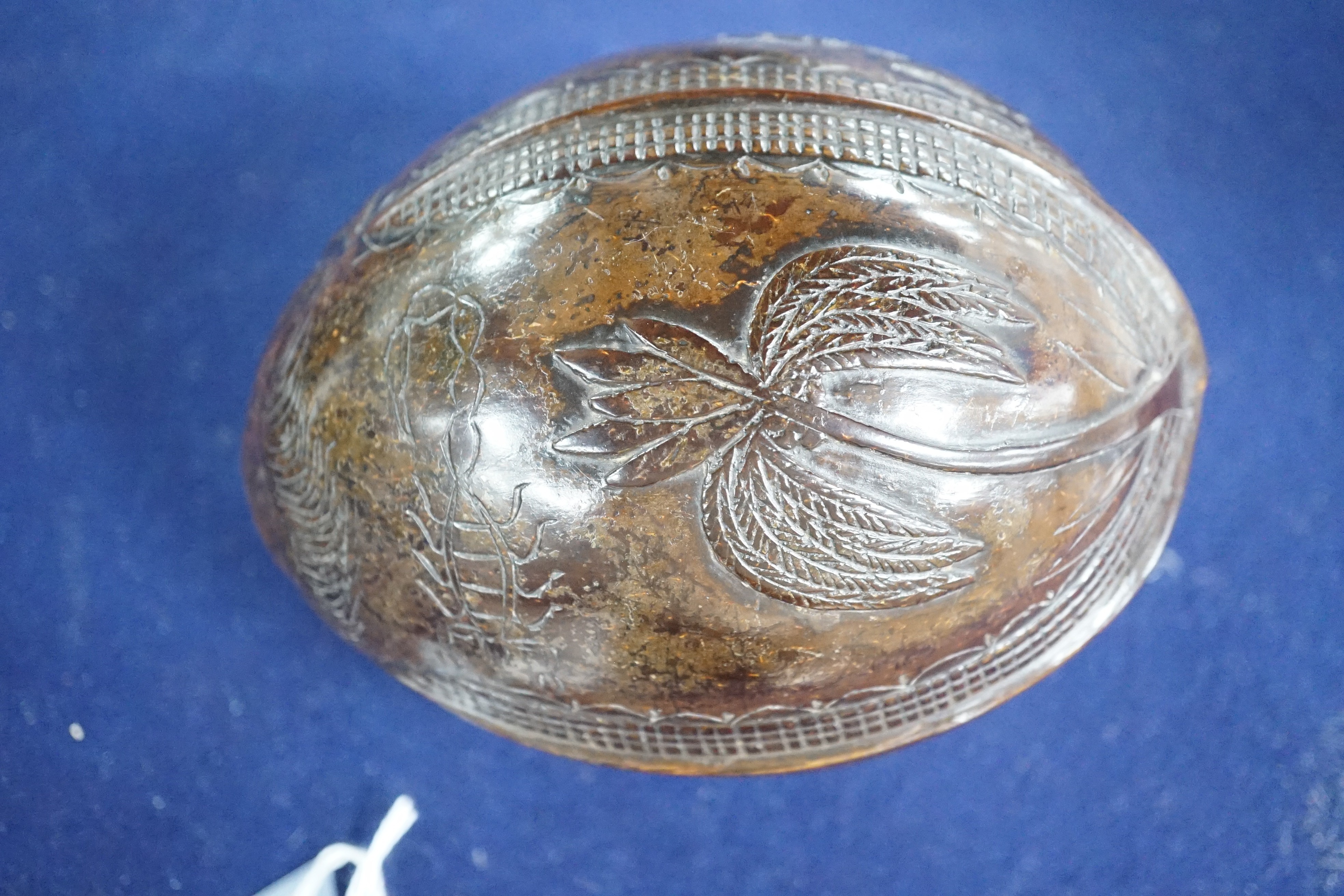 A 19th century carved coconut, 14 cm